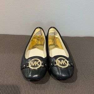 Michael Kors black and gold flats